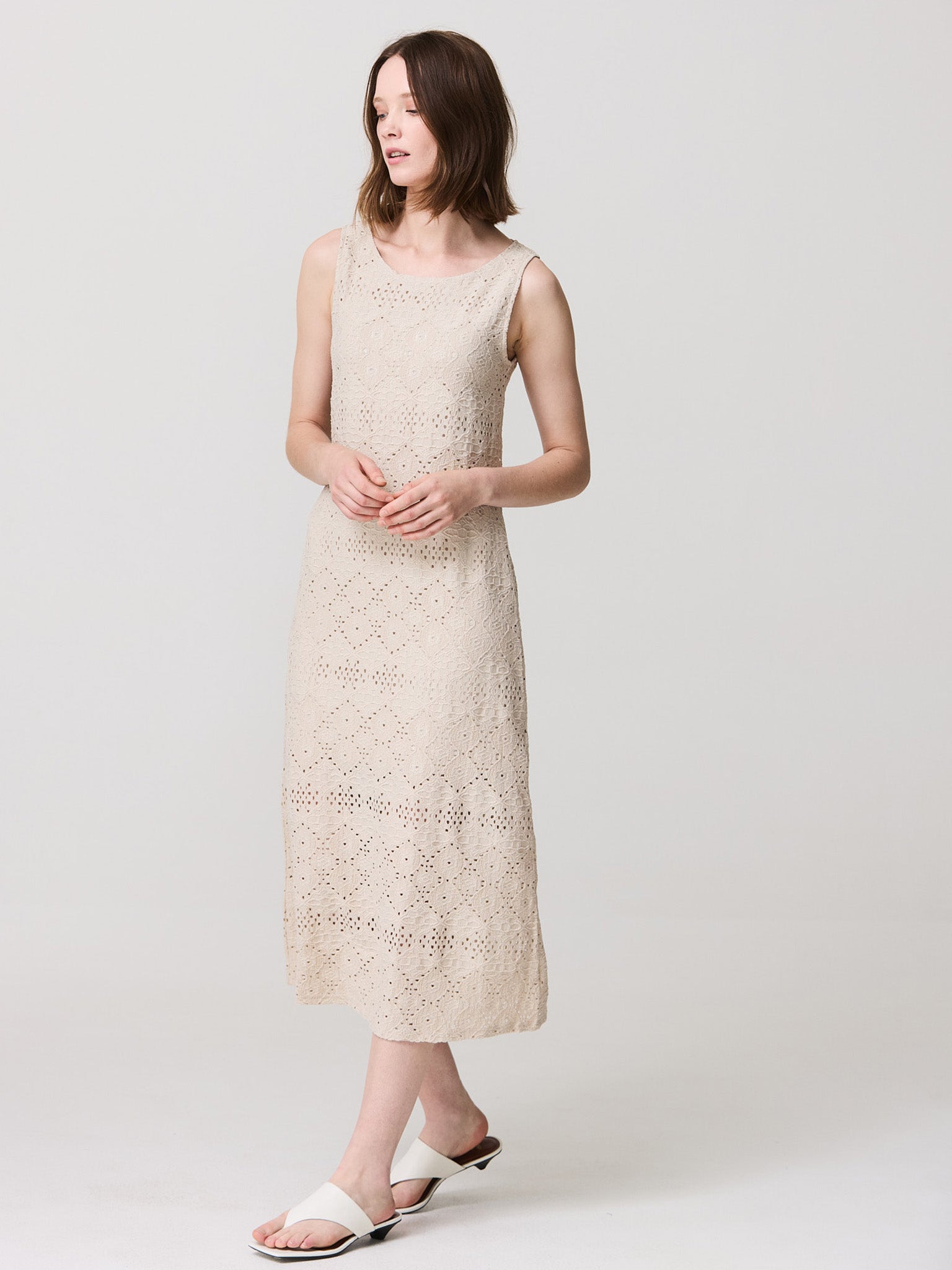 Textured dress with open round neck and sleeveless